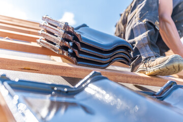 Ceramic tile on a wooden frame of new roof