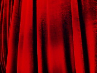 Bright red abstract background reminiscent of pleats of pleasant velvet. Stylized blurred image....