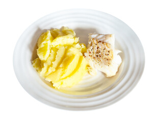 served baked and peppered cod fish with mashed potatoes on white plate cut out on white background