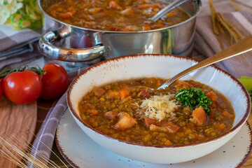 Italian lentil stew. Stufato di lenticchie with pancetta and parmesan cheese served in a bowl