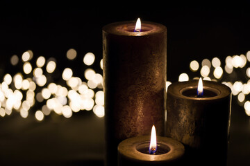 Burnung candles with decorative background