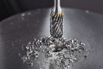 Milling сutter and drill bit make sink in hole in steel billet. Locksmith work.