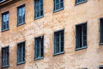 Fototapeta na wymiar wall of old house with windows