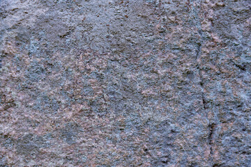 Granite stone view with moss old stone in the forest texture background