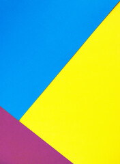 Sheets of multi-colored paper folded one by one and formed straight parallel lines. Pop-art.