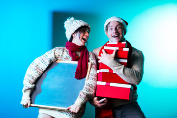 Obraz premium Winter couple. Christmas couple. Gifts. Holidays. Sensual. Man and woman. 