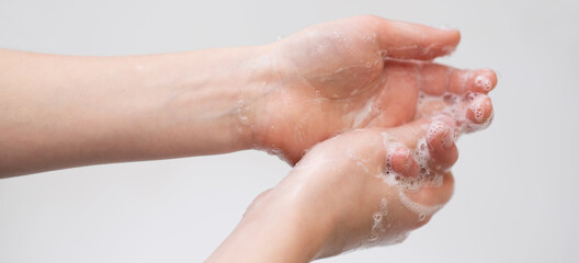 baby hands in foam, hand hygiene