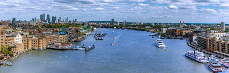 Fototapeta na wymiar A Panorama view of London, UK eastward along the River Thames towards Canary Wharf from the Tower Bridge