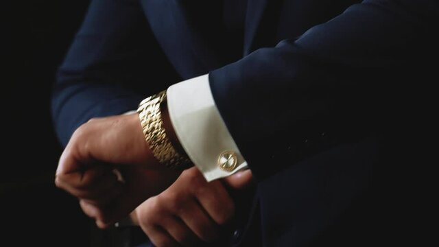 Hands of a man in a suit close up