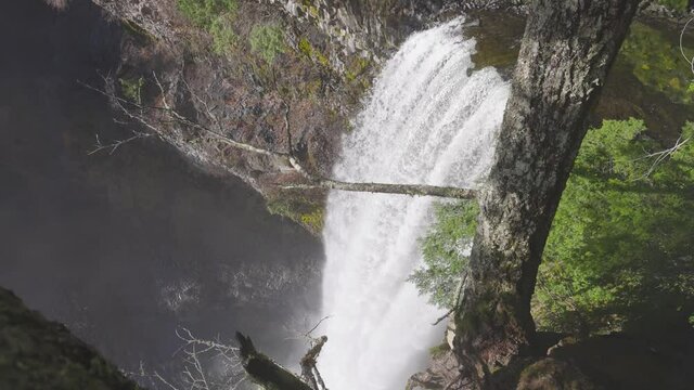 Beautiful waterfall in Canadian Nature in the Rain Forest during sunny winter. Slow Motion 4k. Taken in Brandywine Falls, near Whistler and Squamish, North of Vancouver, BC, Canada.