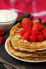Russian cuisine national dish bliny with fresh berries	