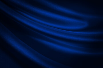 Black blue abstract background. Dark blue silk satin texture background. Shiny fabric with wavy soft pleats. Dark blue elegant background with copy space for your design. Liquid wave effect.