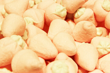 Candy A lot of sweets. Colorful texture using a background. Background rendering. Bright multiple jelly candies in powdered sugar. Confectionery wallpaper concept. Copy space. Shallow focus. Close-up