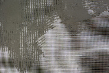 Closeup of styrofoam, polystyrene insulation of wall with mesh and mortar
