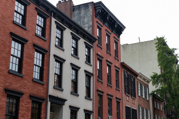 Fototapeta na wymiar Row of Old Colorful Brick Apartment Buildings in Greenwich Village of New York City