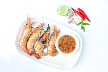 Grilled shrimp with seafood sauce in plate isolated on white background.