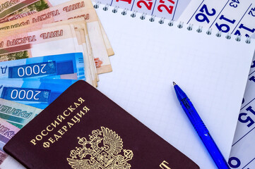 Russian passport. Calendar and Money. Ruble bills and stationery.
