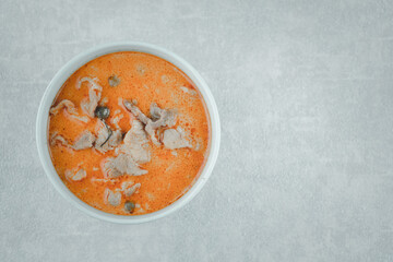 Panang curry with pork served in bowl