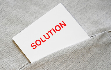 SOLUTION text on the white sticker in the shirt pocket.