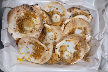 Grilled scallops shell with butter and garlic