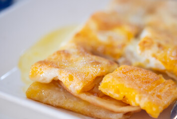 Dessert style of fried Roti Thai. Roti cut in pieces.