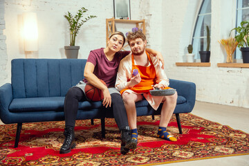 Gender stereotypes. Wife and husband doing things unusual for their genders in social meanings,...