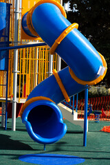 playground equipment in the park. Children colored slides playground  on outdoor. Outdoor Playing...