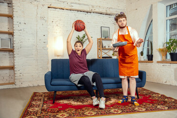 Gender stereotypes. Wife and husband doing things unusual for their genders in social meanings,...