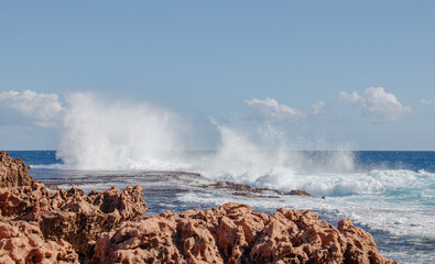 waves crashing on rocks Australia