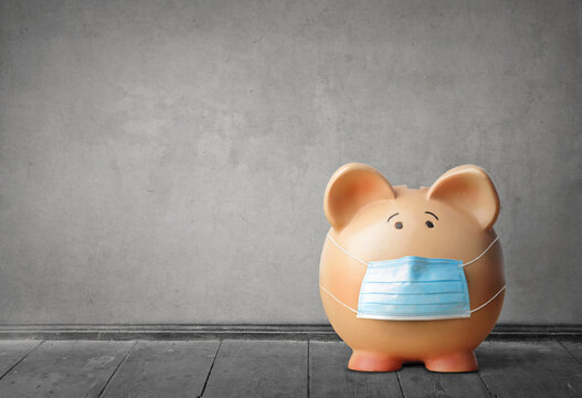 Piggy Bank With Mask On A Gray Background