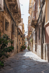 Narrow street in the town of Syracusa, Sicily. 