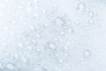 Background of soap foam and bubbles on a white background, macro photography
