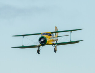 vintage Beech travellair biplane aircraft in flight