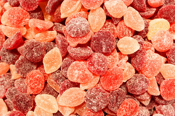 Candy A lot of sweets. Colorful texture using a background. Background rendering. Bright multiple jelly candies in powdered sugar. Confectionery wallpaper concept. Copy space. Shallow focus. Close-up