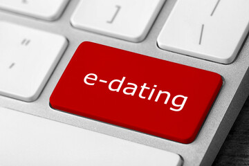 Love button on laptop keyboard, closeup. Online dating site