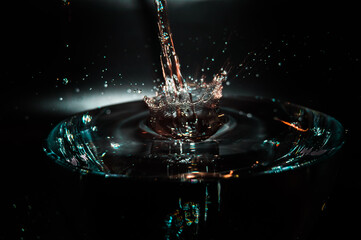 Pouring water and creating perfect splash