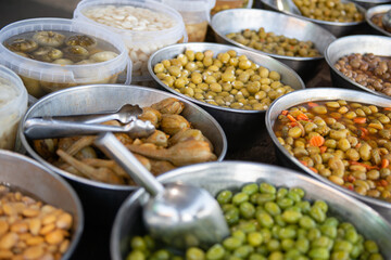 Salting olives, onion, peppers and other salting sold on outdoor spanish market. Food