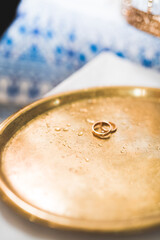 Two golden wedding rings isolated background concept