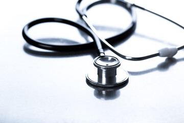 Black stethoscope for doctor diagnostic coronavirus disease, medical tool for health on blue...