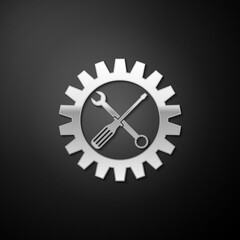 Silver Maintenance symbol - screwdriver, spanner and cogwheel icon isolated on black background. Service tool symbol. Setting icon. Long shadow style. Vector.