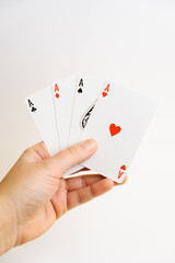 poker aces in hand isolated on white background