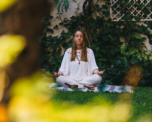 woman doing alternative medicine playing tibetan singing bowls that heals