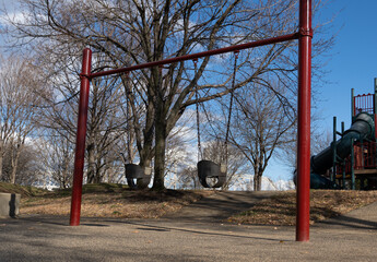 Fototapeta na wymiar angled photo of a swings in a park in downtown Louisville Kentucky
