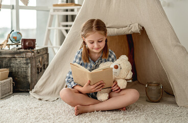 Nice little girl with paper book