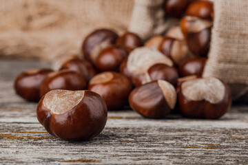 Chestnuts on an old wooden table