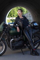 Fototapeta na wymiar woman in black with a motorcycle