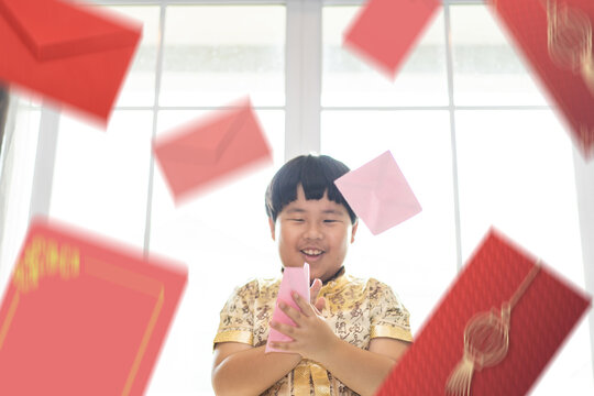 The child was delighted to receive Angpao on the Chinese new year.