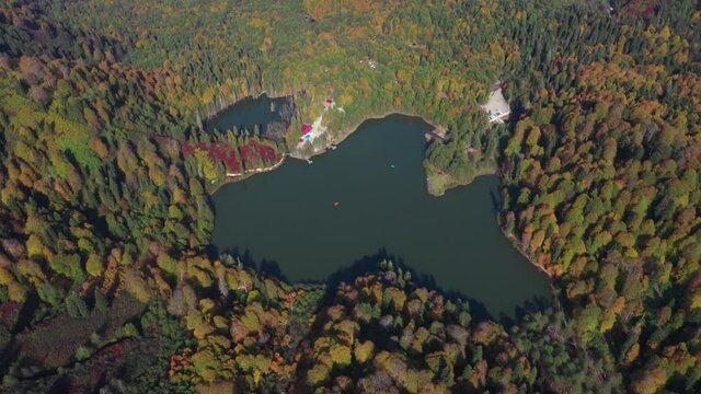 A drone view of the lake and green nature which is fascinating. As additional information, the name of this lake is Karagol and it is located in Artvin/Turkey
