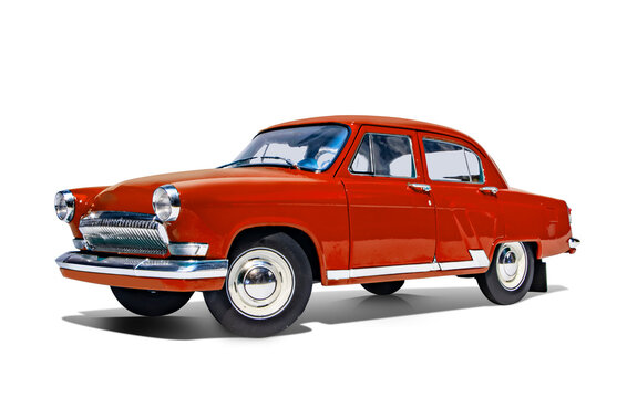 A red vintage GAZ M21 Volga isolated on white studio background, front left side view, wheels turned right