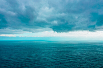 Sea and clouds, storm background, waves on water.